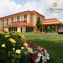 La Quinta hotel exterior with flowers and logo